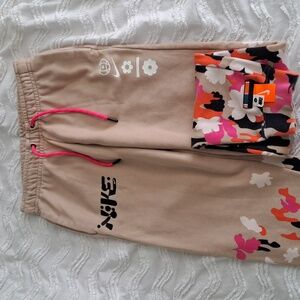 Tan and floral prink nike sweats/ joggers